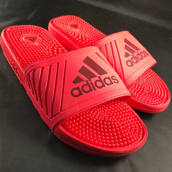 red and black adidas slides